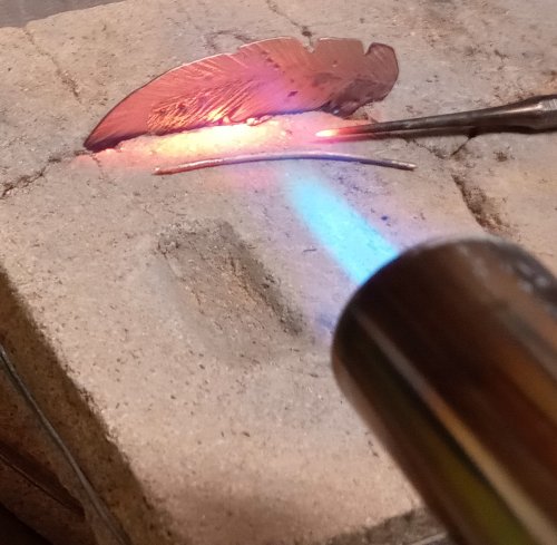Judy Larson's Copper Feather Earrings Remodel Into Cuff - , Metalwork, Cutting, Cutting Tool, Cutters, Oxidizing Wire, Oxidizing, Antiquing Wire, Antiquing, Stamping, Stamps, Texturing, Butane Torch, Soldering, Solder, Design, sanding, filing, polishing, hold the earrings while heating